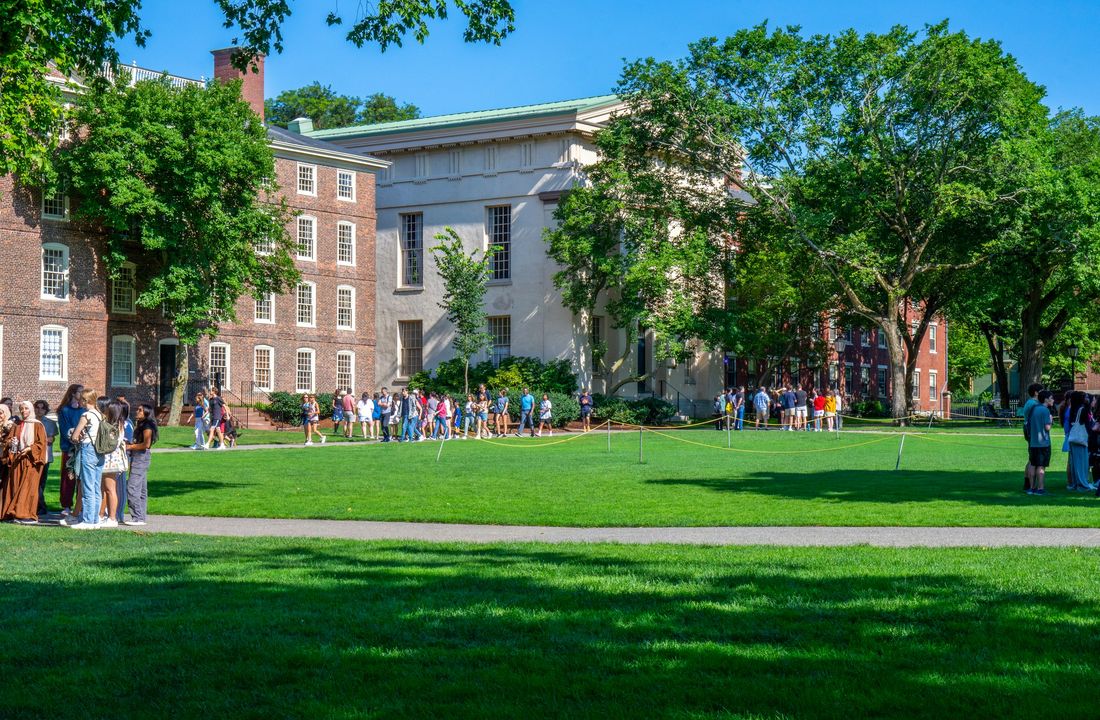 Students on a university lawn in the fall